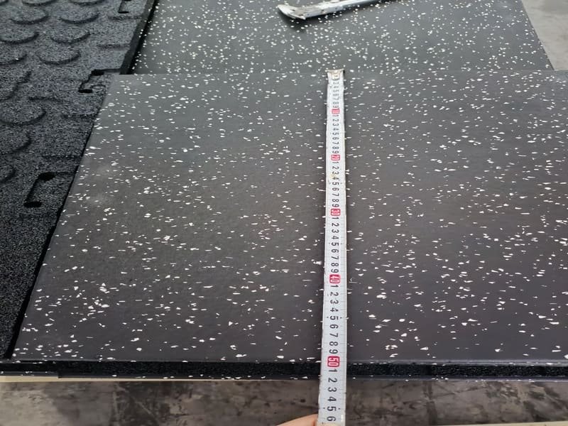 A detailed Technical Data Sheet for gym flooring on a clipboard